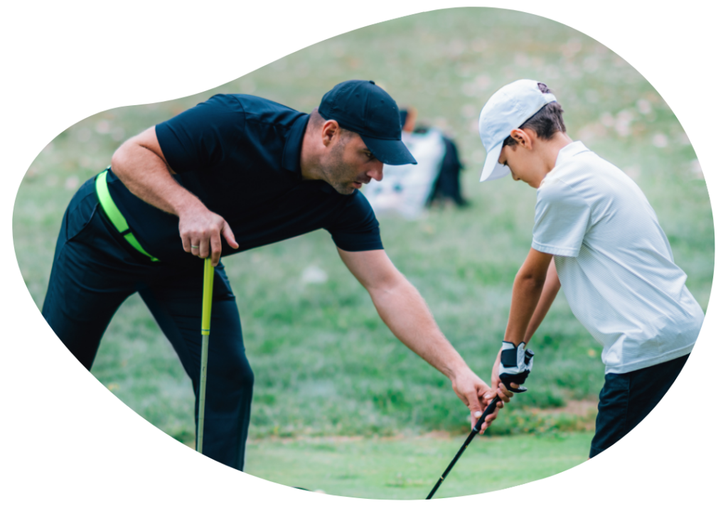 PGA professional showing someone how to hold their club